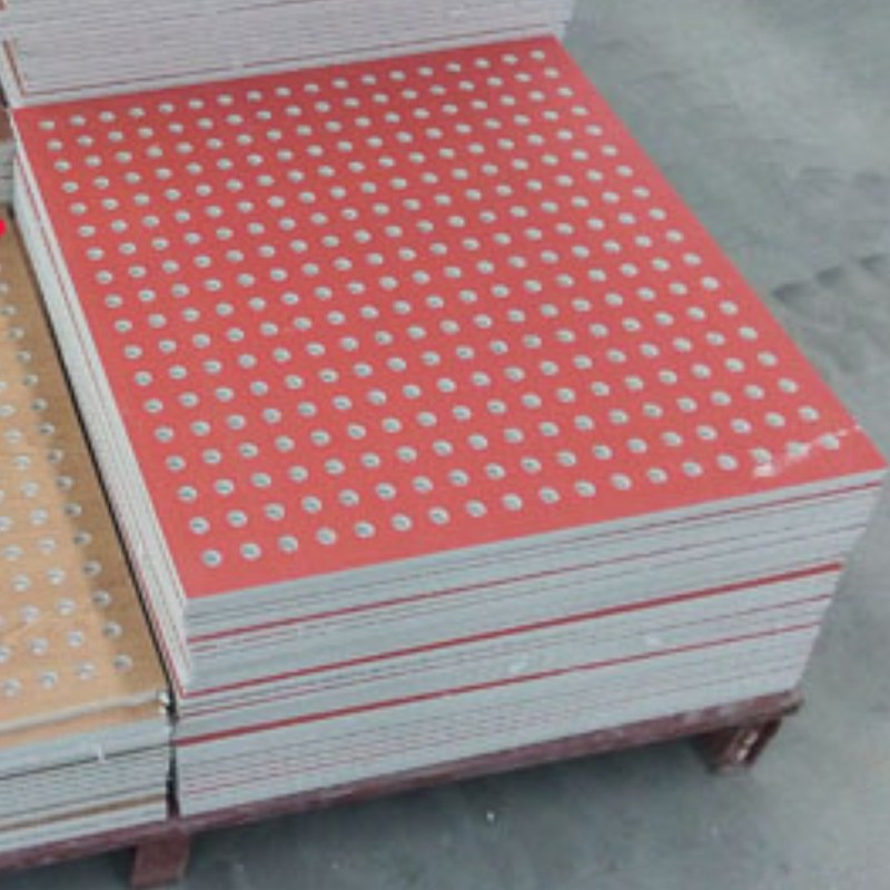 Red perforated PVC gypsum tile stack